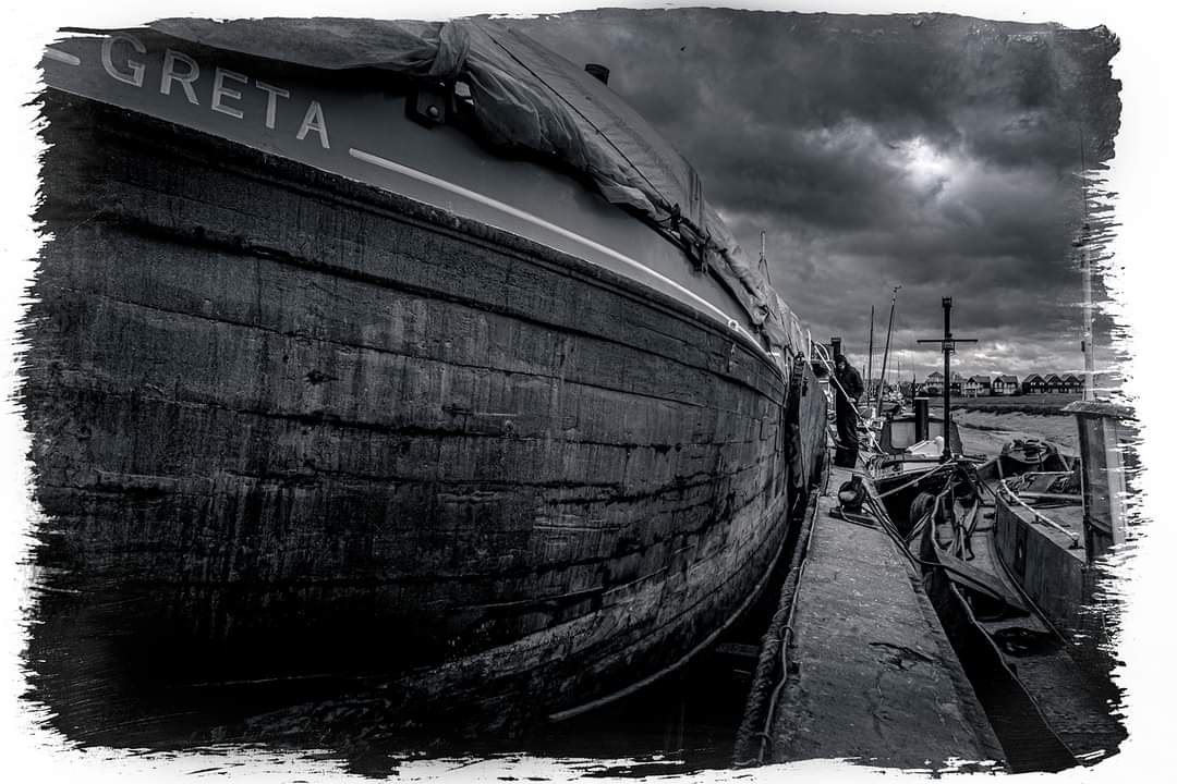 Docked #greta #thamesbarge #gretathamessailingbarge #drydock #blackandwhitephoto #faversham #littleships #creek #gettingreadyfor2024 @GretaBarge1892