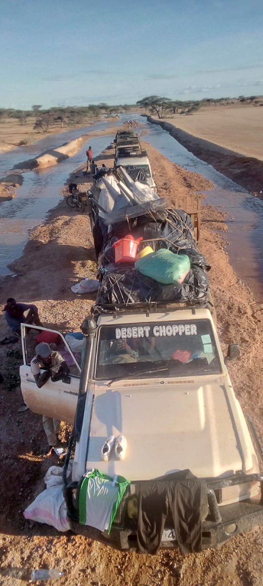 JilloIbrae's tweet photo. These vehicles spent three days here at Elboji, between Kalacha and Elgadhe, owing to  heavy rains that swept the murram road. Among the travellers are thirty six students going home after  closure of their schools. https://t.co/NWR5SCRDcM