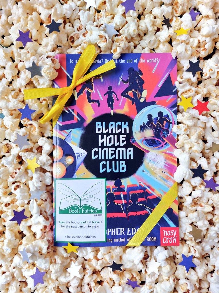 @the_bookfairies are sharing copies of the fantastic Black Hole Cinema Club by Christopher Edge at cinematic locations today!

Who will be lucky enough to spot on? 🎬🍿✨️
#ibelieveinbookfairies #BlackHoleCinemaClub #TBFCinemaClub #TBFNosyCrow