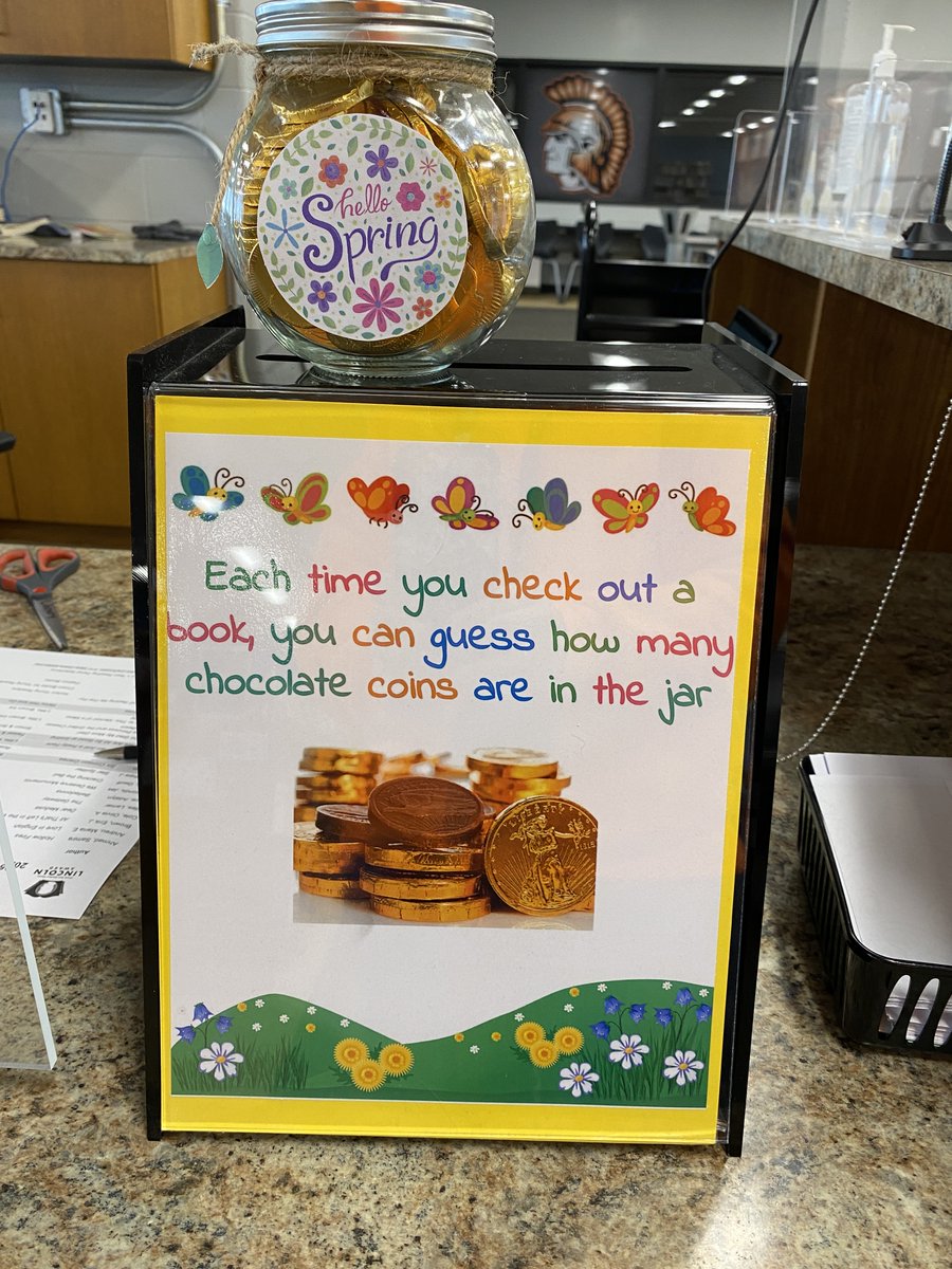 Celebrating School Library Month in the media center with Post It Note Book Reviews and a book check out contest.