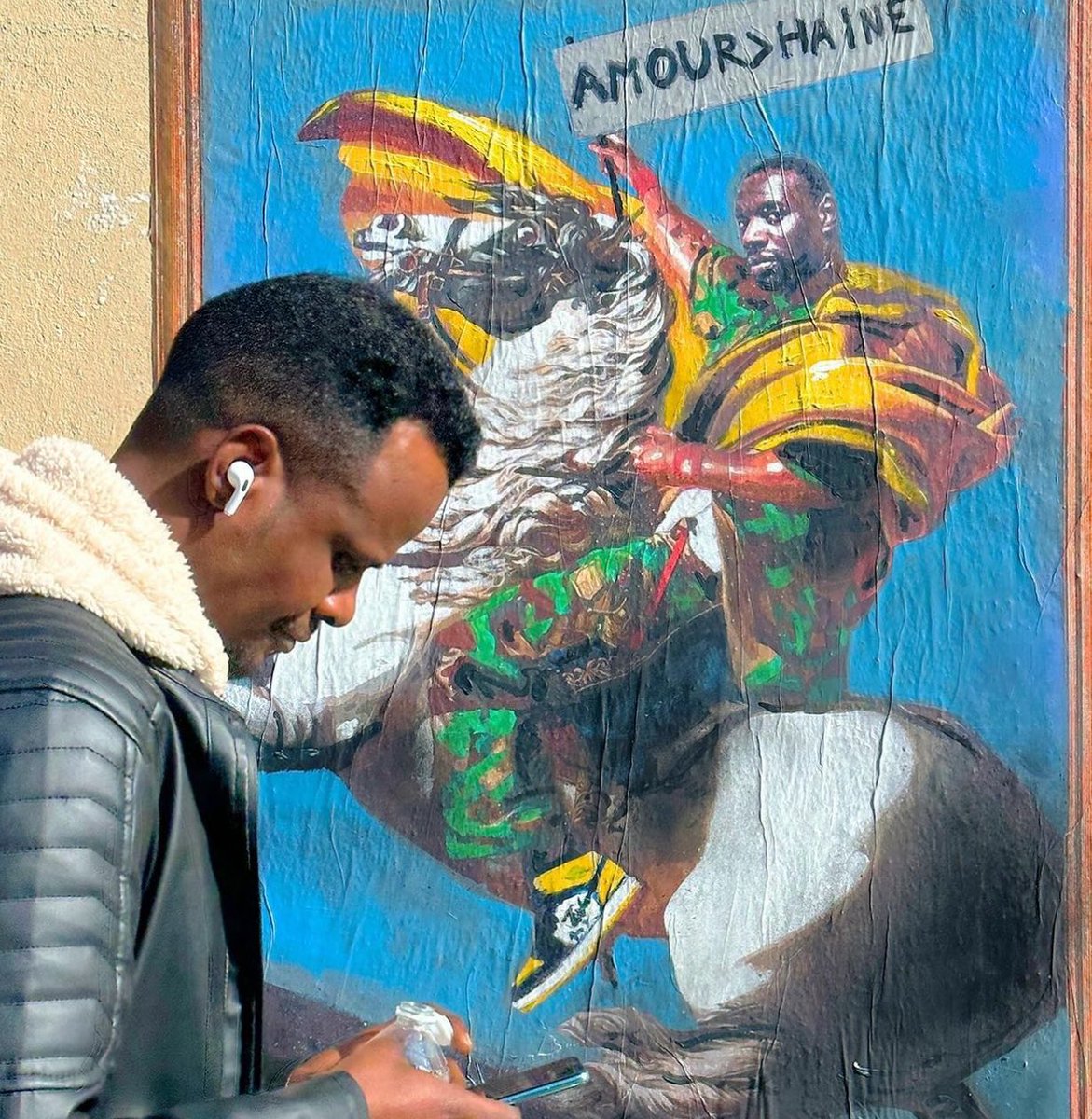 Love is greater than hate. Actor #OmarSy as a modern Napoleon in Paris. Canal Saint Martin.