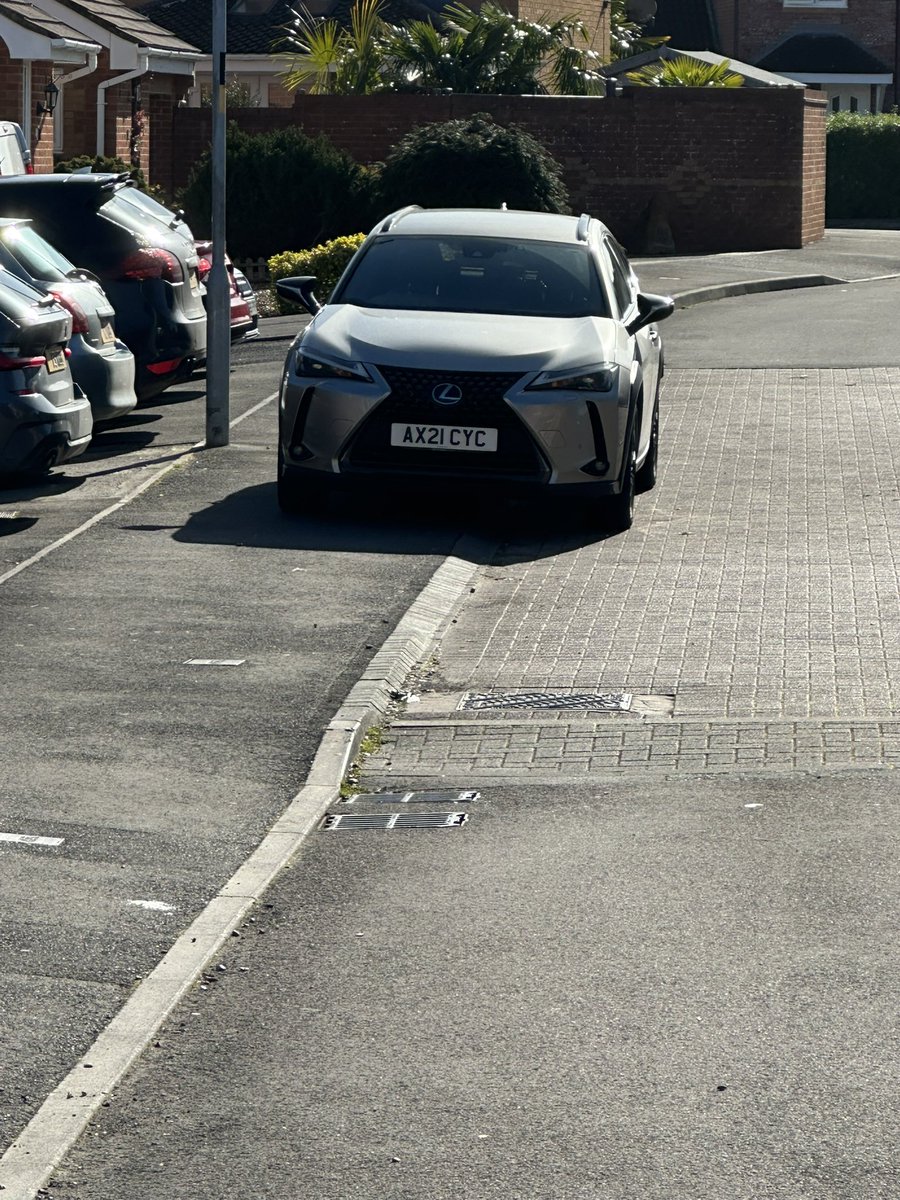 Reg no AX21 CYC parked in Primrose Drive Melksham Wiltshire on Saturday March 30 2024 at 8.58am. Parked on the wrong side of the road and partially on the footpath, impeding pedestrian access.
