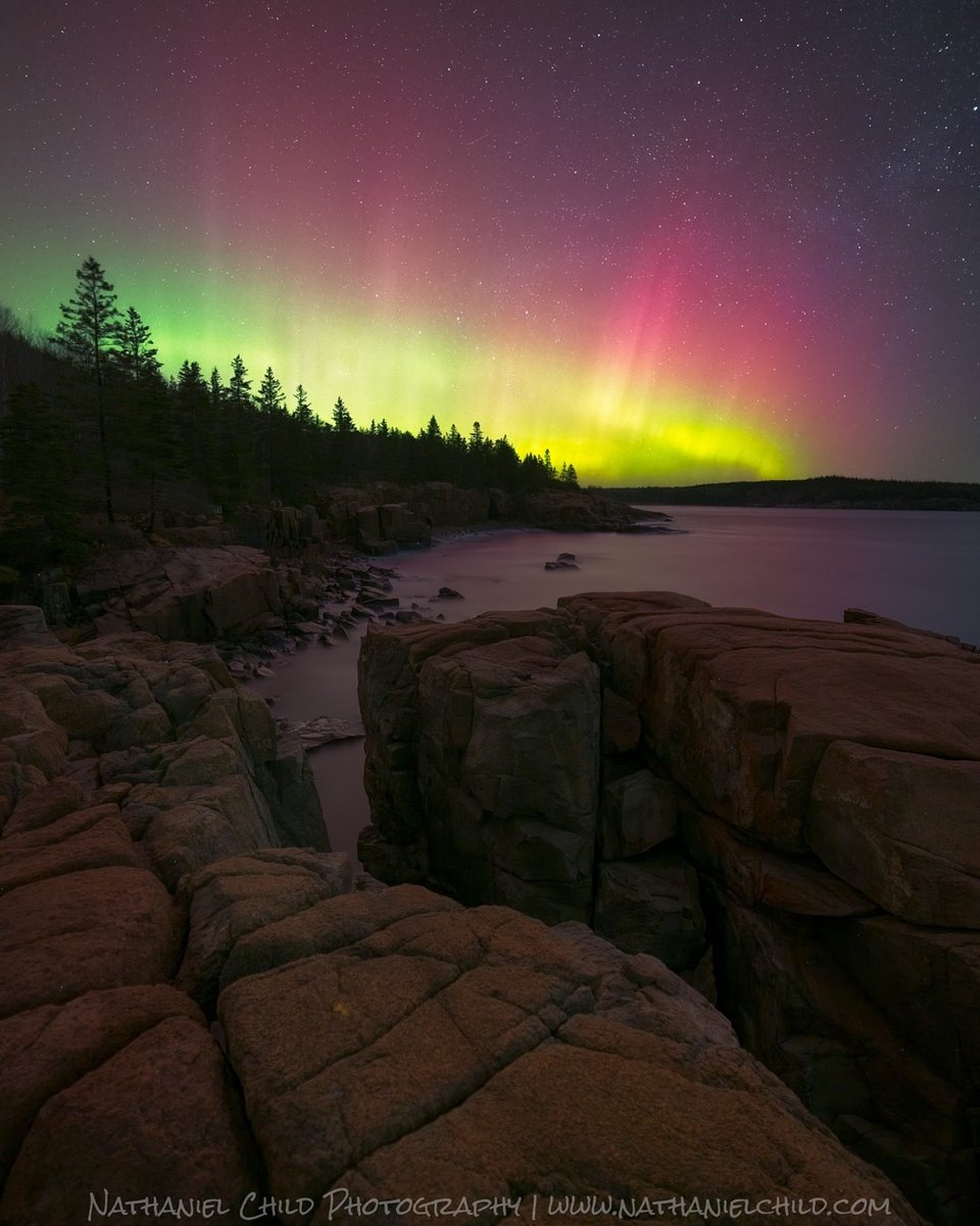 The aurora borealis illuminates the sky over Acadia National Park. ⁠
