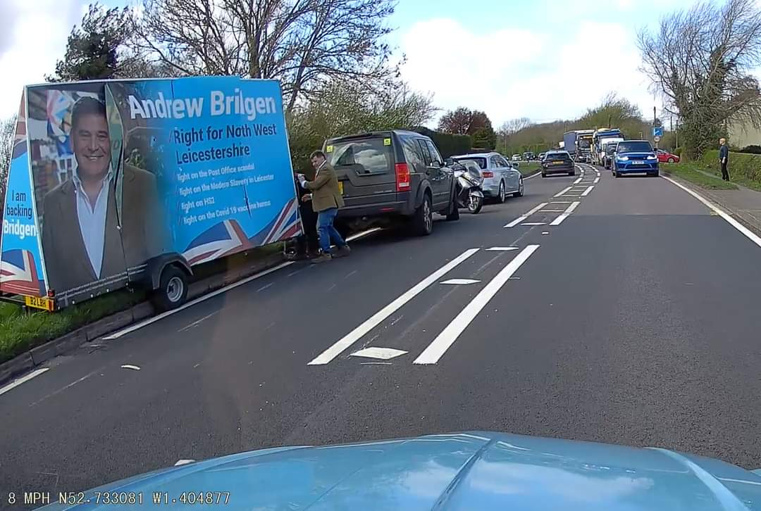 Nothing like your local MP Andrew Bridgen driving a sign with his face on round the constituency, only for the wind to hit it, cause an accident and now a main road is snarled up. Caption competition anyone? #andrewbridgen