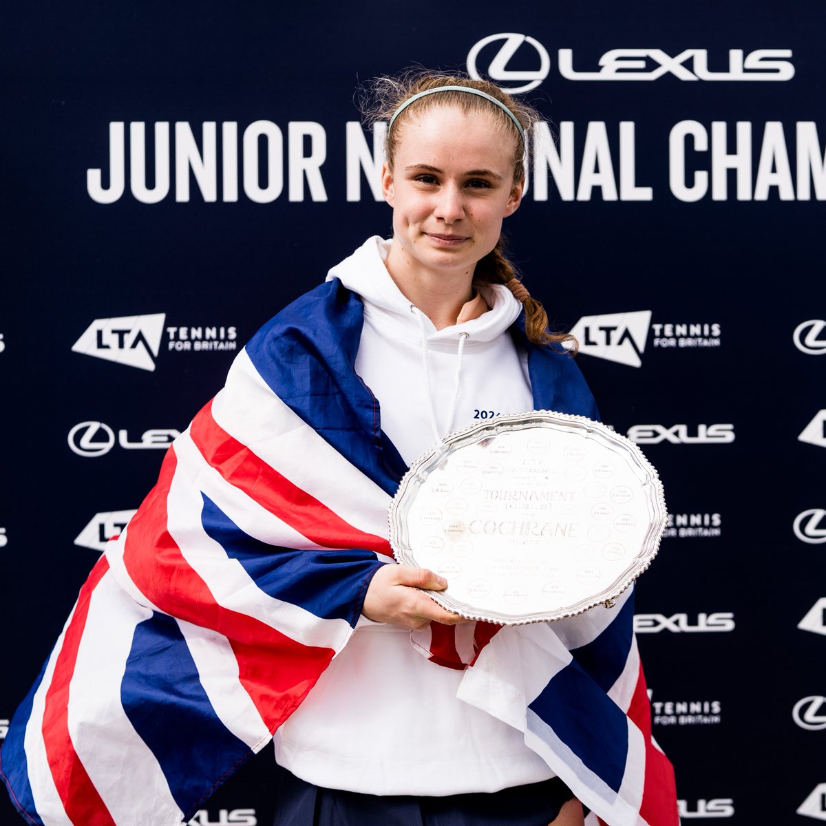 Photo of Hollie Smart with her trophy after winning the 16U Girls' Lexus Junior National Championship final