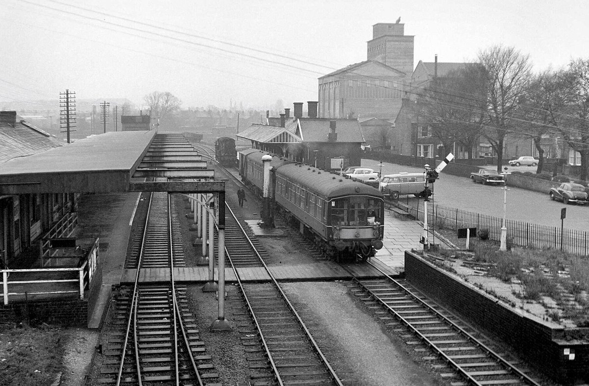 A train for Cambridge with a van attached at the rear leaving Bedford (St.Johns), December 1966 Photo by Roger Joanes