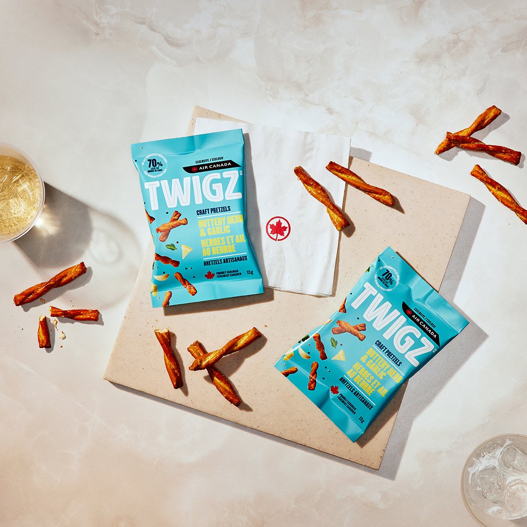 Our knot-so-secret new snack? 🥨 Enjoy Alberta’s own TWIGZ Buttery Herb & Garlic pretzels, complimentary on select flights and as part of our refreshed snack basket on board!