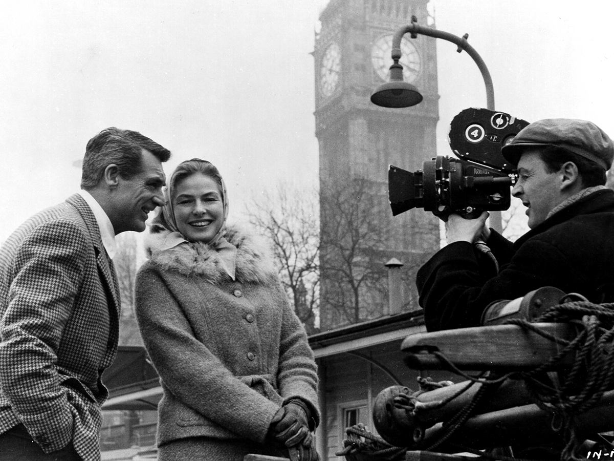 Filmmaker & choreographer Stanley Donen on the set of INDISCREET ('58) with Cary Grant and Ingrid Bergman. See it tomorrow as part of Donen's centennial birthday lineup showcasing his rich filmography – from dances on the ceiling to songs in the rain. It all starts at 12pm ET.