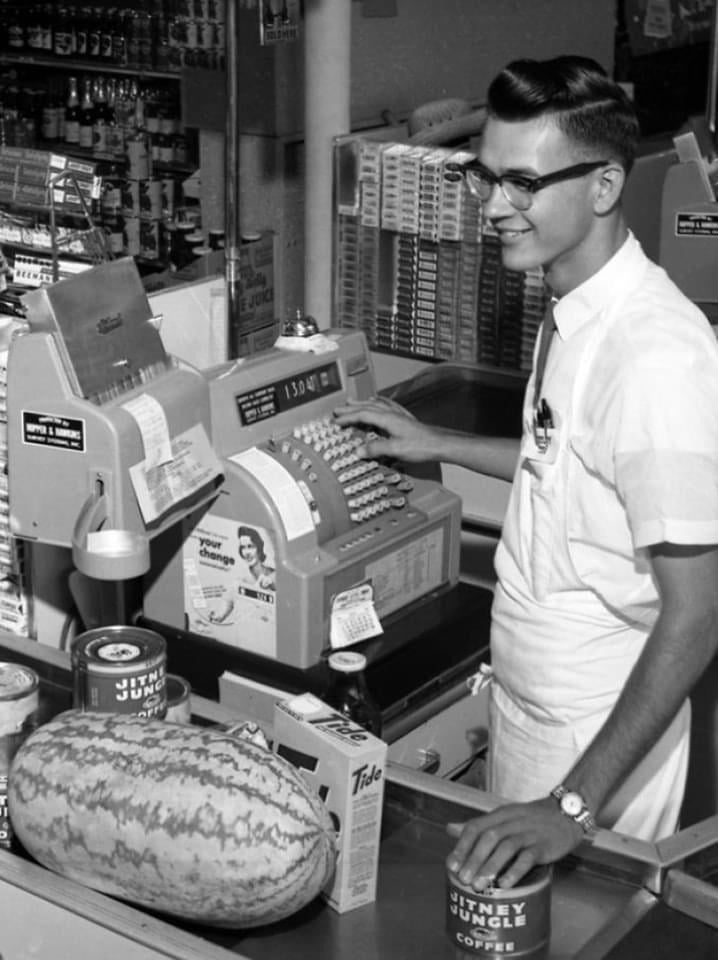 A grocery store clerk in Tallahassee, Florida, 1962