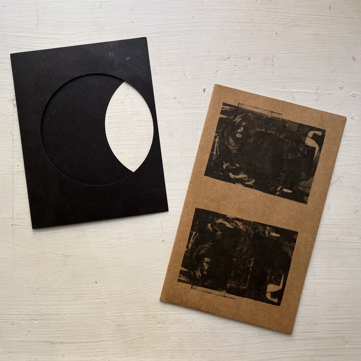 april 2024's zine, « APPARENT DIAMETER », is a fold-out poster zine printed on brown kraft paper, housed in a black cardstock sleeve that 'eclipses' itself. the poster measures 8.5x14 inches when unfolded. the components are somewhat ephemeral, without any binding.
