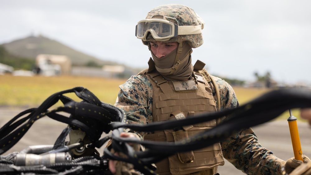 📍 MCBH (April 12, 2024) This week's hot shot winner! Cpl. Bryce Snyder checks the operability of a cargo net during helicopter support team training. HST training refines the skills necessary to complete external lifts of equipment and supplies. #hotshot #vote #hawaii #HST