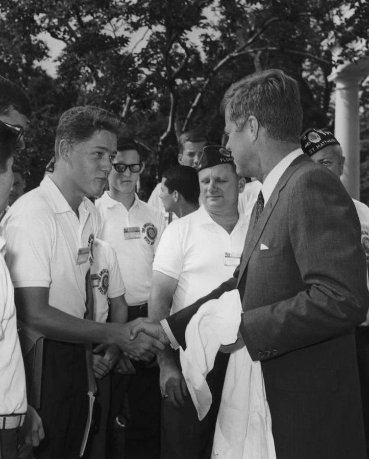 Bill Clinton shakes hands with John F. Kennedy, 1963.