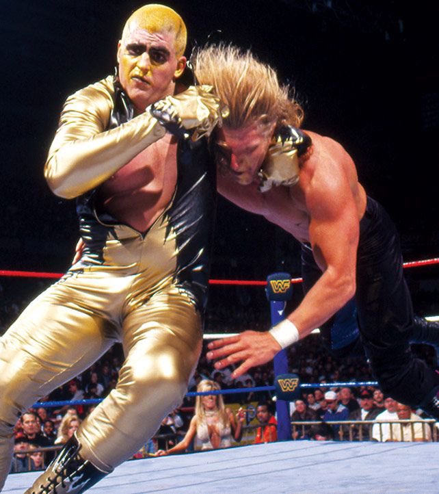 happy 55 to dustin rhodes. “he wanted to distance himself from his dad dusty rhodes, known as the son of a plumber and the american dream and came up with the character golddust: gold tights/face paint, blonde wig, lipstick and openly flirted w/ other wrestlers in matches.” jk