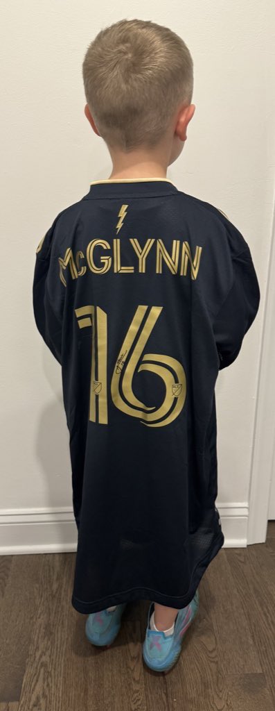 When you get your first @PhilaUnion @JackMcGlynn7 game used Jersey what do you do? You try it on with his boots of course!!! One happy Dude!! #doop