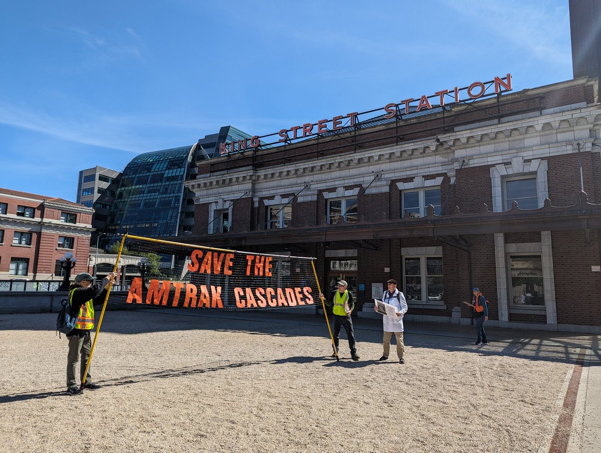 Rail advocates are flyering outside of King Street Station to call for an expansion of Amtrak Cascades — the passenger line that runs from Portland to Seattle to Vancouver BC. They say that WSDOT has not been ambitious enough in scaling up service amid a climate crisis.