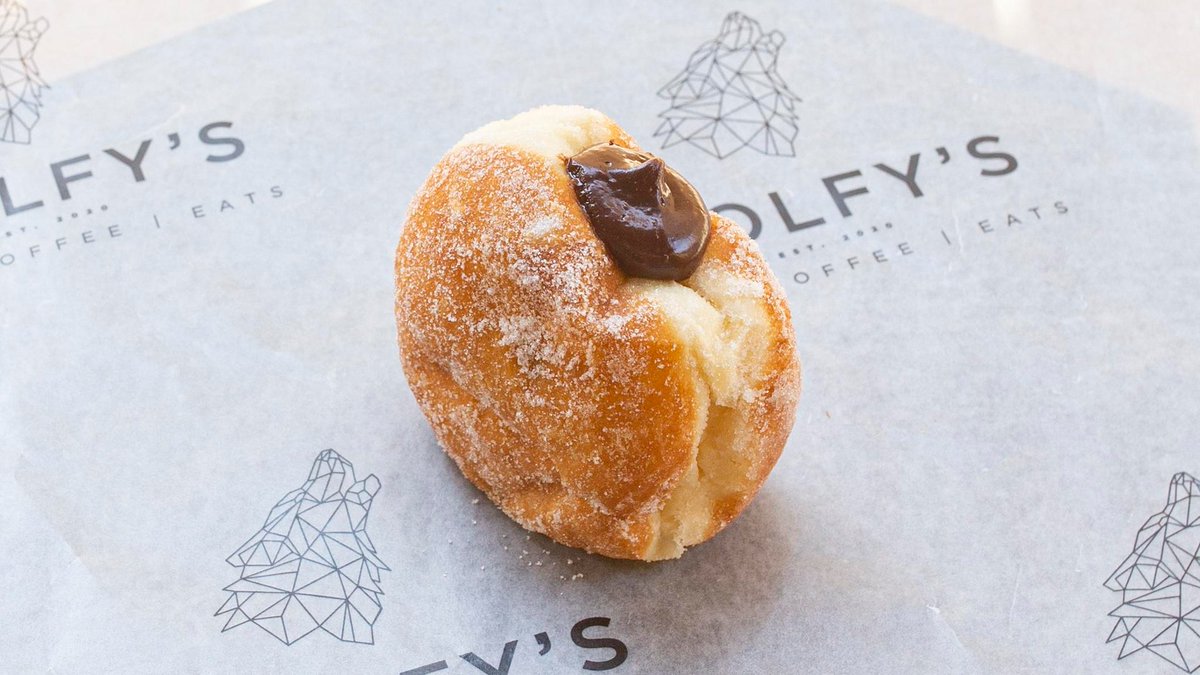 Indulge in our bestselling St John's Chocolate Doughnut at Wolfy's Bar! Made with rich dark chocolate and a fluffy doughnut base, it's a treat you can't resist. 😋 #ChocolateLovers #DoughnutDelight #WolfysBar #MenuMustTry linktr.ee/wolfysbar