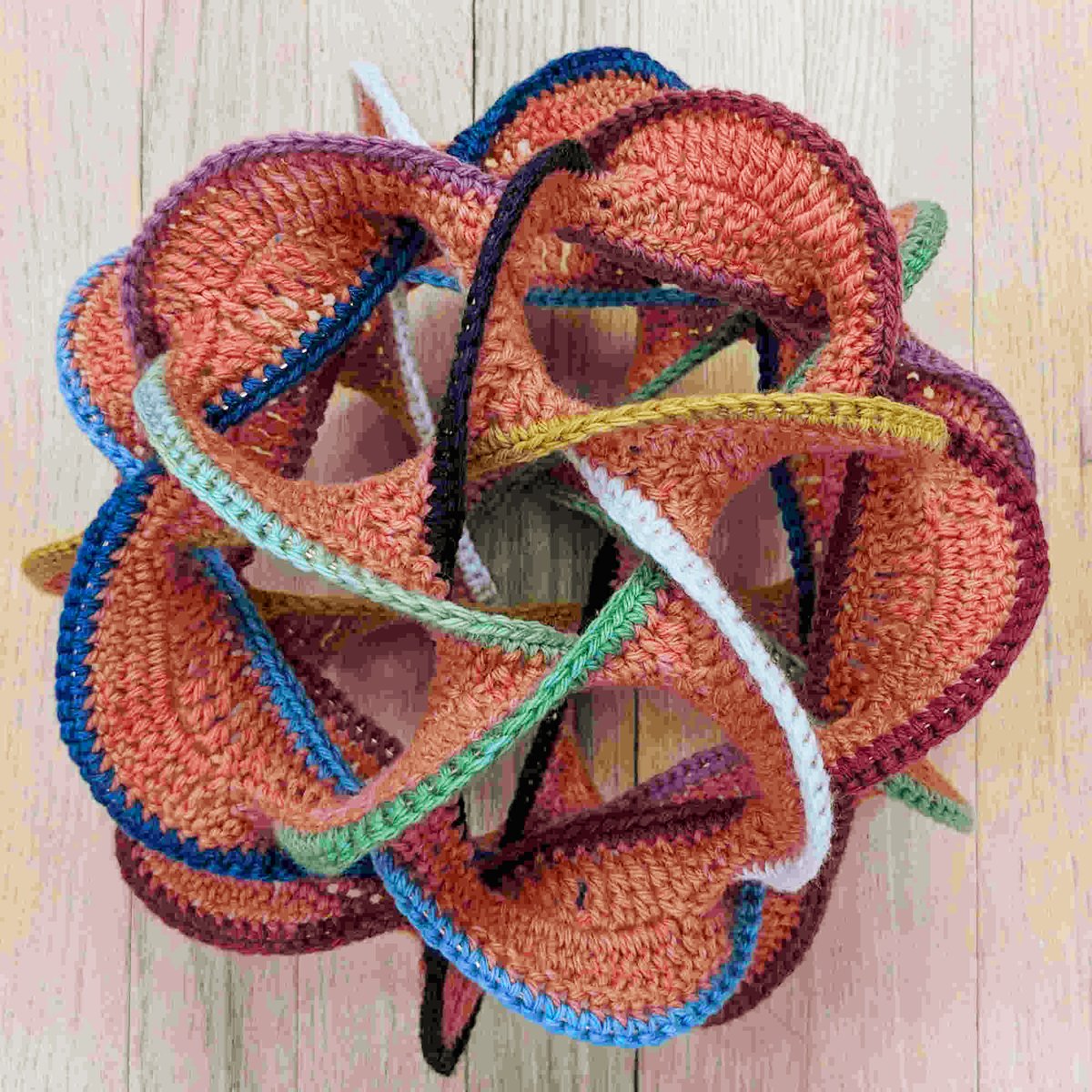 What's going on here?  No, it's not AI.
Math-art-matician Shiying Dong, who published a paper on her topological crochet in the Bridges Conference, has the answer — and she is once again offering online classes with MoMath.
Visit momath.org/crochet; limited space available.
