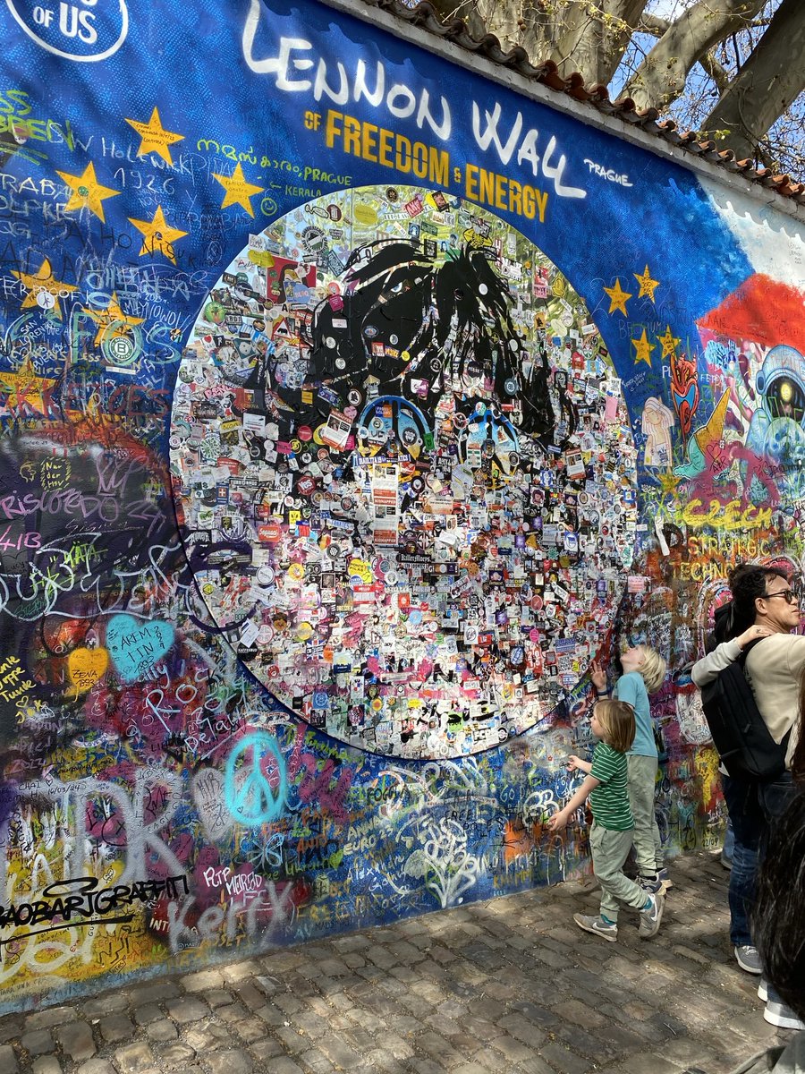 My niece sent me a picture of the John Lennon wall in Prague, Czech Republic. The wall is covered in graffiti, stickers, pictures and messages from fans and others who see Lennon as a symbol of a better world.