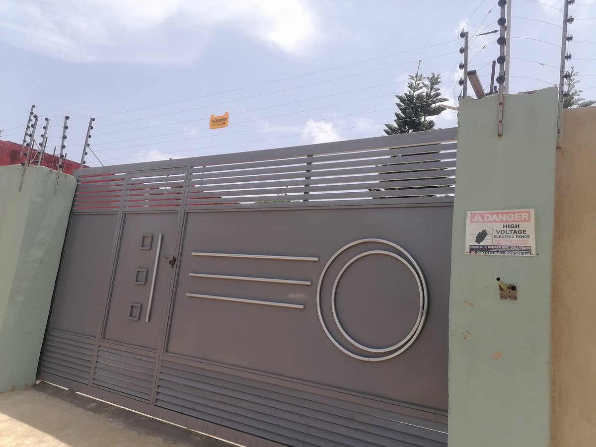 Electric Fence on Brand New Heavy Duty Sliding Gate @ Old Barrier Kasoa. Call us for your Professional Metal Gate(Swing or Sliding) & Security Systems with Timely Delivery of Services. #metalgate #gate #metalgatedesigns #fence #ElectricFence #razorwire #gatemotorautomation