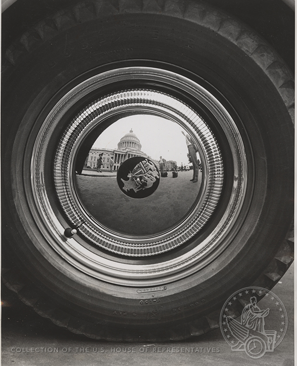 The caption adhered to the reverse side of this 1939 photo cryptically states that the “auto hub cap reflects the Capitol’s central position in the nations’ life.” #ArchivesSnapshot history.house.gov/Collection/Det…