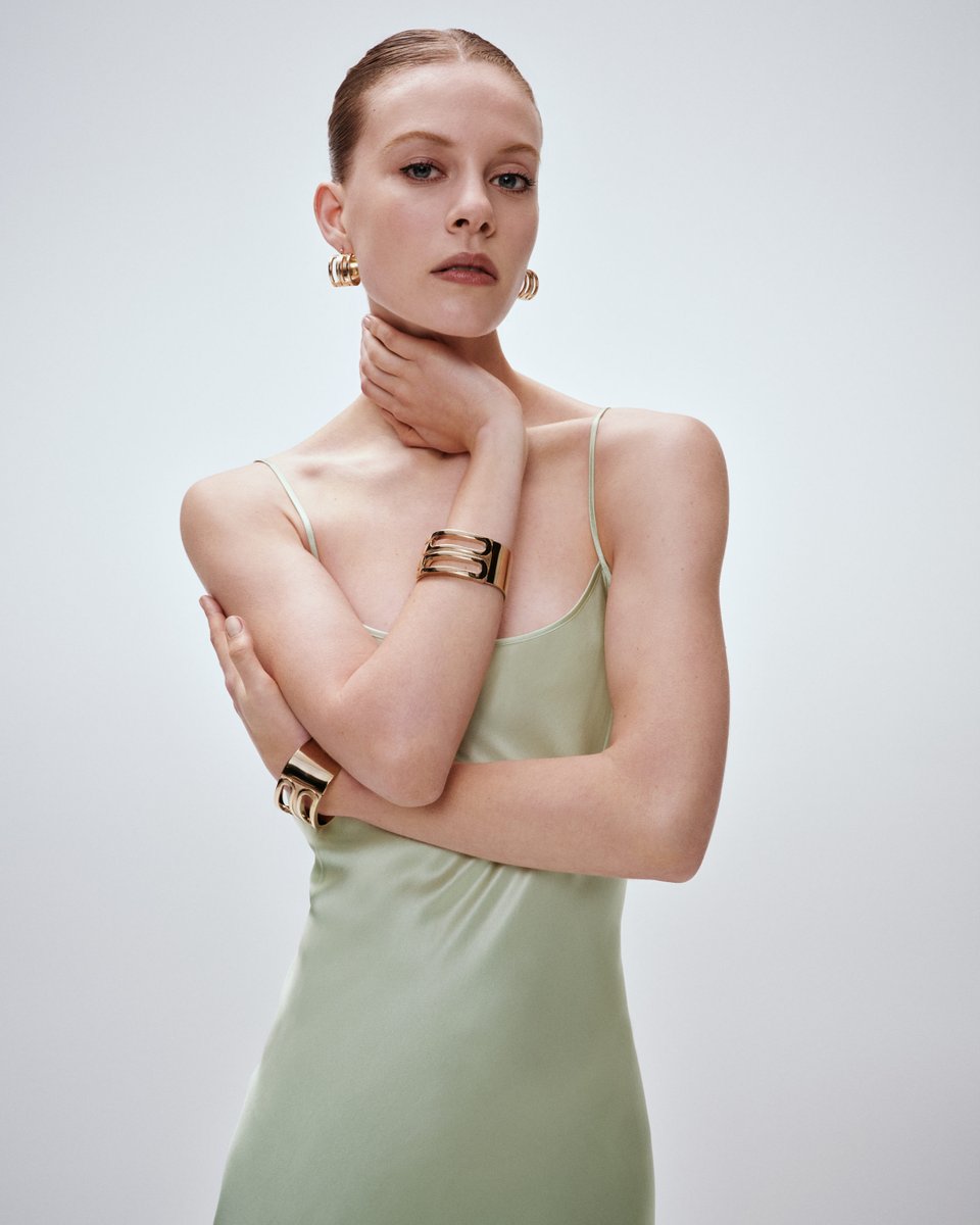 Statement-making silhouettes are paired with gold accents featuring the house’s signature B. Shop the exclusive Cami Floor-Length Dress in Jade >> victoriabeckham.visitlink.me/mfJ9gk #VBOccasionwear