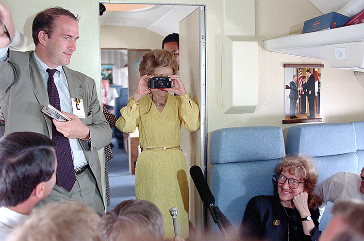 Say cheese! #ArchivesHashtagParty #ArchivesSnapshot --- #NancyReagan aboard the First Lady Airplane taking a photograph of the press during the Moscow Summit 05/31/1988 catalog.archives.gov/id/276564835