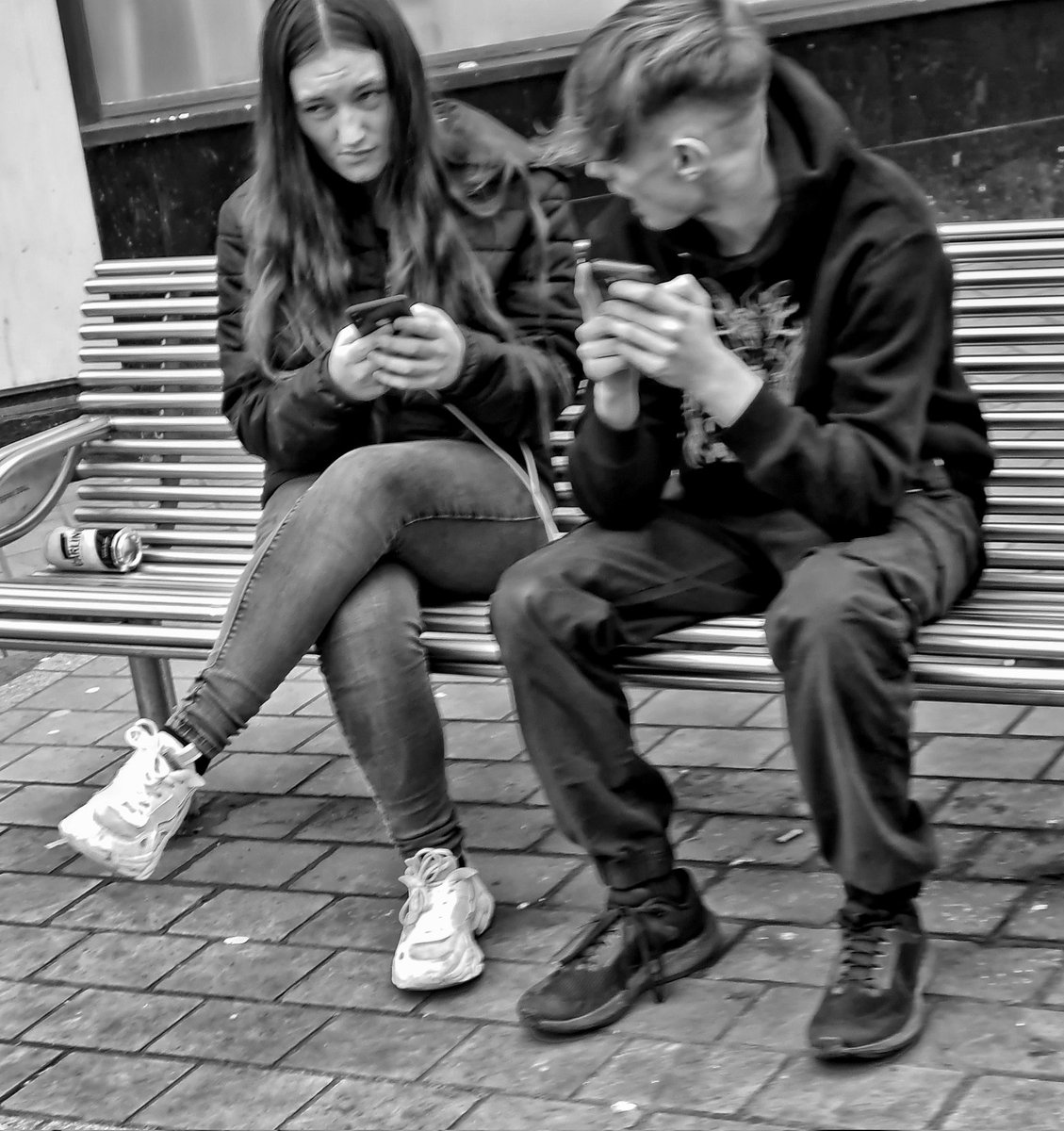 The human equivalent of a couple of squirrels grasping their nuts. #phone #social media #bnw #streetphoto #streetphotography