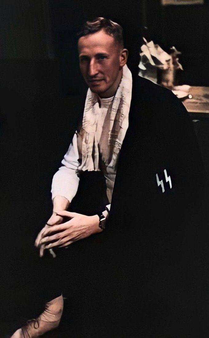 Colourized image of Reinhard Heydrich wearing his fencing uniform and cape