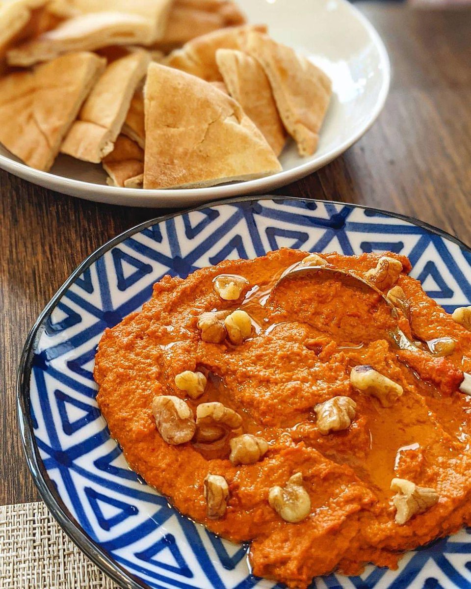Muhammara 
📍 Alepo, Syria 🇸🇾 
⭐  4.4

Discover Syria: tasteatlas.com/syria

Muhammara is a nutritious dip from the Syrian city of Aleppo. It is made with roasted red peppers, olive oil, and ground walnuts. The peppers give the dish a particular sweetness and smoky flavor,…