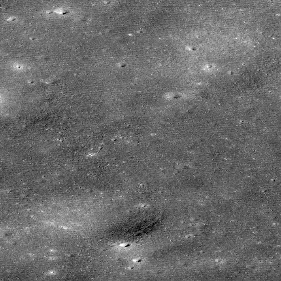 There's something weird in the middle of this photo of the Moon's surface. Open the image up, and see if you can find it. It's right in the middle. And then look at the next tweet to see what it is.