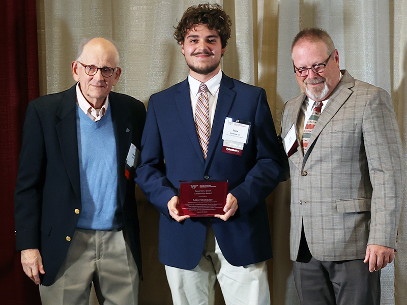 FWC major Max Nootbaar was awarded the CNRE David William Smith Leadership Award for 2024, based on leadership, community service, and professionalism. David Smith (at left) joined Max on stage with Department Head Joel Snodgrass (at right).