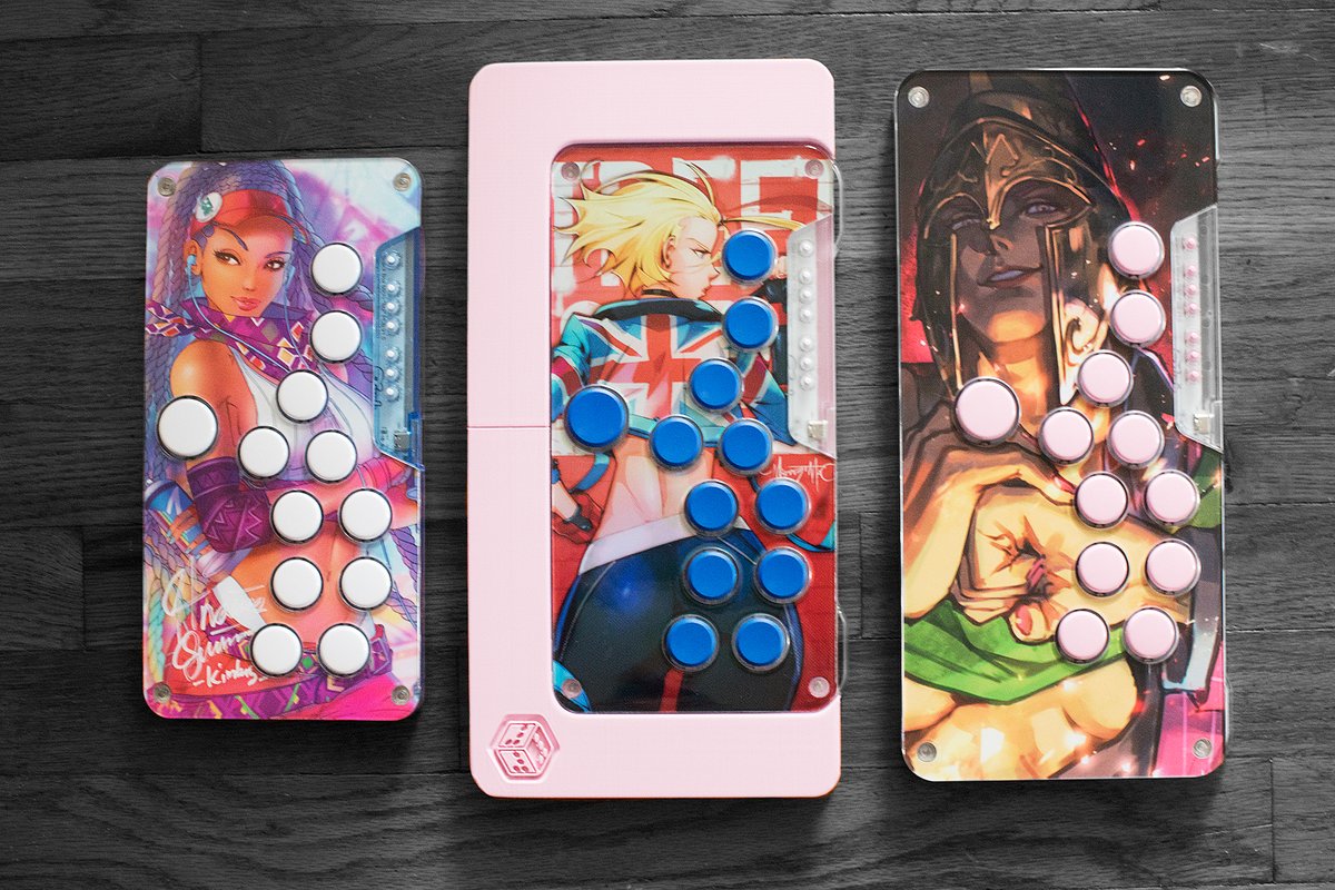 sochies's tweet photo. Micro XL is here! Check out its size! Left to right: Micro, Micro + Footsie, Micro XL. #FightstickFriday

Snack Box Micros by @junkfoodarcades
Footsie (Light Pink Matte) by @CheatboxProject
Cammy holographic artwork/print by @maddestmao
Other artwork printed by @powotato https://t.co/OiwzeYDEsa