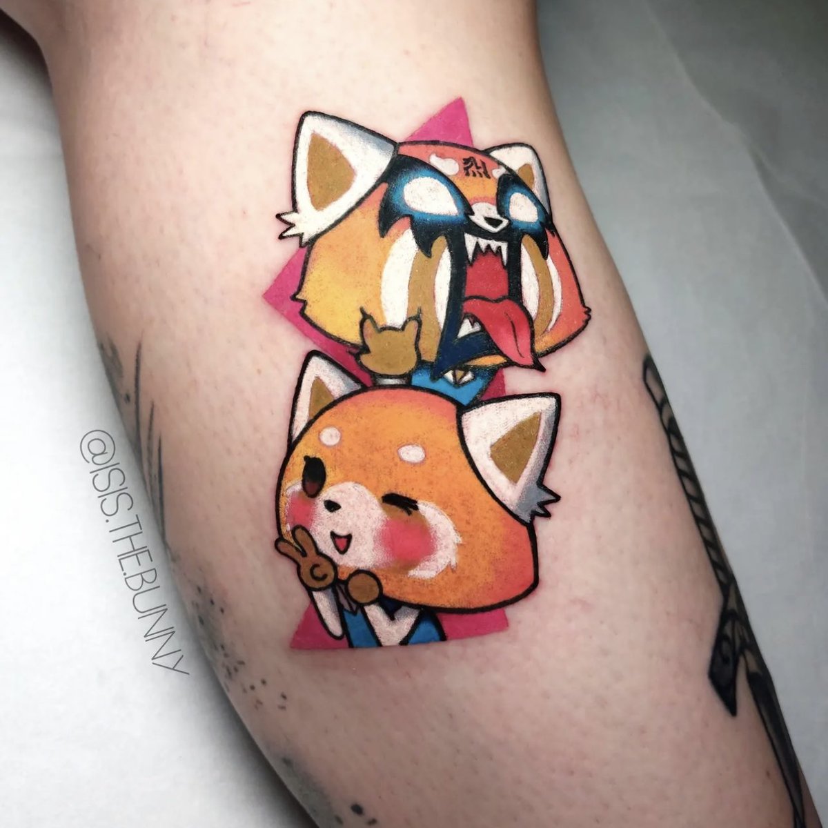 From ✌️🧡 to 🤘🔥 #Aggretsuko tattoo by isis.the.bunny on IG