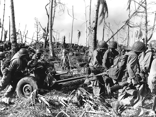 Soldiers of the U.S. Army 7th Division moving a 37 mm Gun M3 anti-tank gun on Kwajalein, Marshall Islands, in February, 1944. #History #WWII