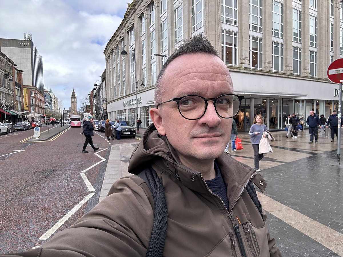 30-something years ago I was standing inside the shop behind me. And where the pink bus is, a bomb went off, injuring many people. I can still hear it. And it drove me down this career path. Northern Ireland proves that peace is possible, essential and deserved #Peace