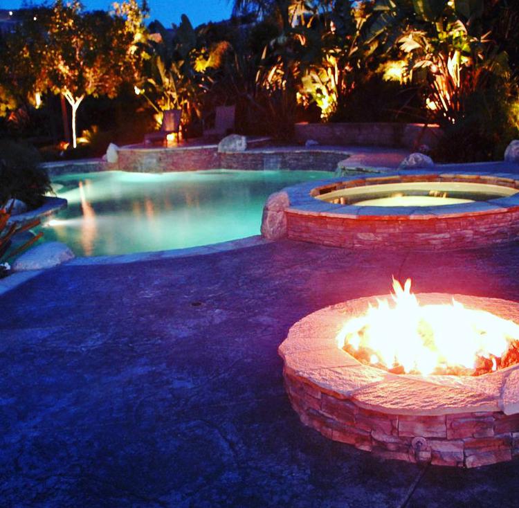 pools_infinite's tweet photo. Looking for warmth and beauty? Add an outdoor fireplace or fire pit! Stone, tile, and brick options abound. Need help deciding? Contact Infinite Pools at 951-354-9888 or visit https://t.co/asSu3cgM3i. We'll make your yard dreams come true! 🏡✨#OutdoorLiving #Fireplace #FirePit https://t.co/A9uoqwJXBL