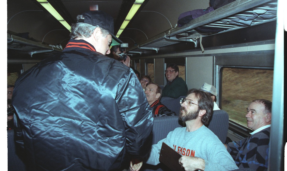 On his way to the Baltimore Orioles opening day baseball game, President Bill Clinton opted to take a ride on the 'MARC' train on April 5th 1993. He is seen here greeting other passengers. Photo by Bob McNeely [42-WHPO-P02237-01]