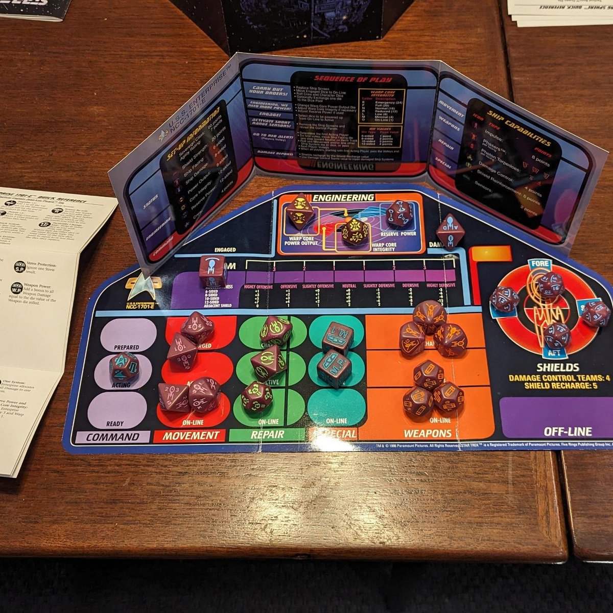 Celebrating First Contact the nerdiest way I know how... by digging the First Contact Collectible Dice Game out of storage and trying to decipher the icons! Picard vs Borg Queen! Sensors vs Assimilation! (I haven't played this since 1999, but the set is too cool to give up.)