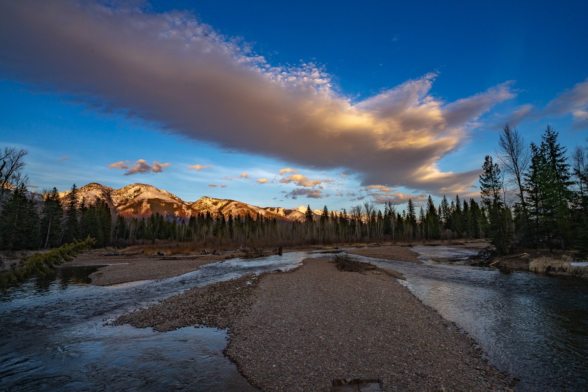 The Swan River as the day's last light hits the mountains behind