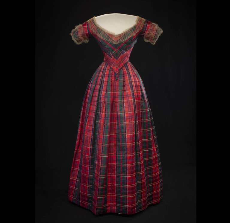 Tartan Day is celebrated annually #OnThisDay. The Drummond tartan silk satin dress was made for Lady Willoughby d’Eresby to wear at a ball held during Queen Victoria’s visit to Drummond Castle in Perthshire in 1842. @HighlandFolk collection #tartanday #tartan #dress