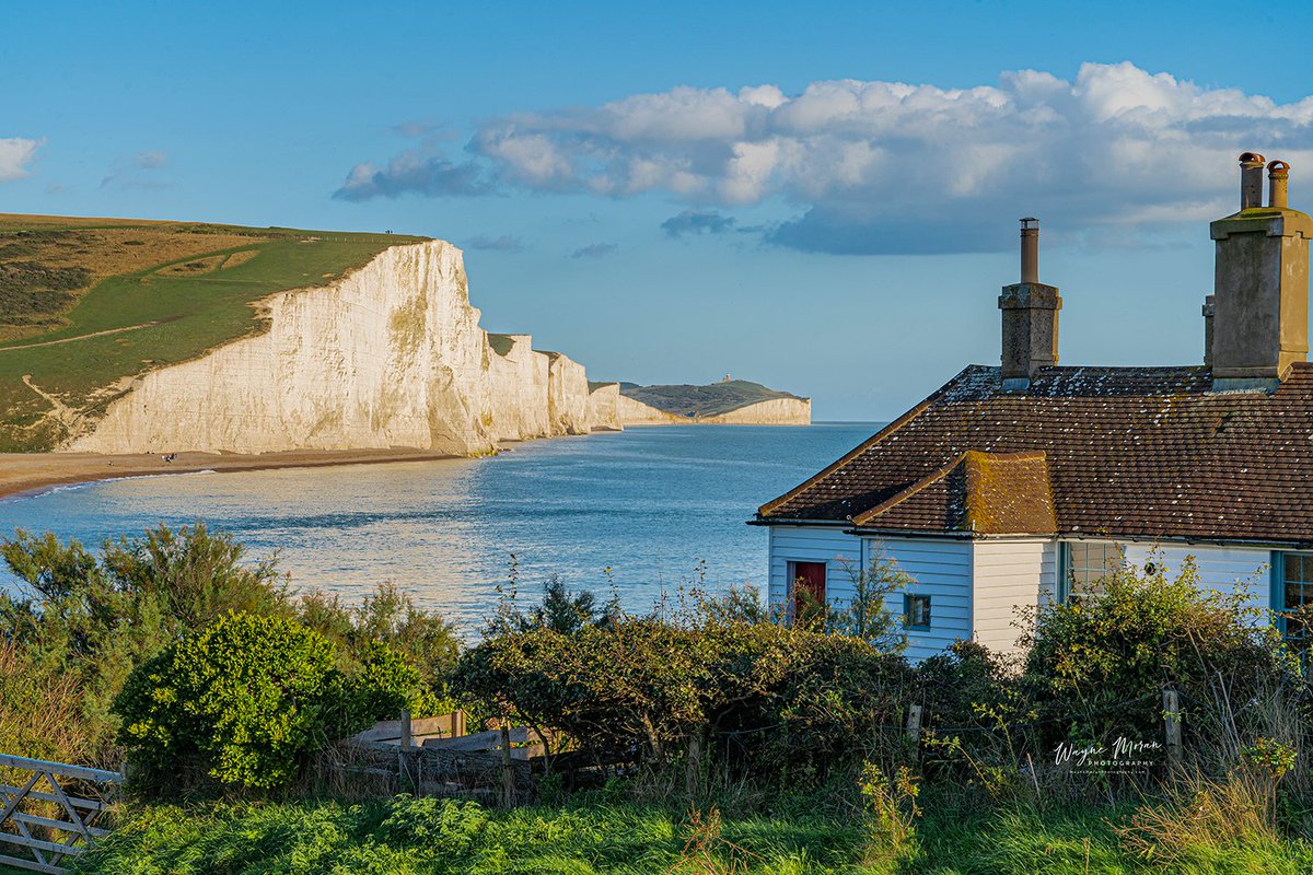QP glorious cliffs Iconic Seven Sisters Cliffs Sussex England The Seven Sisters are a series of chalk sea cliffs on the English Channel coast, and are a stretch of the sea-eroded section of the South Downs range of hills, in the county of East Sussex, in south-east England. The