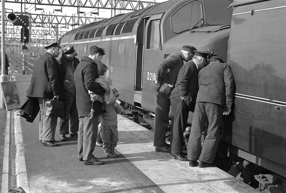 On Thursday 26th March 1964, English Electric Type 4 No. D219 'Caronia' of Carlisle Upperby, is proving difficult to separate from the first coach of a train which it had brought from Euston at the north end of the Down platform at Nuneaton (Trent Valley) station. Photo by C A