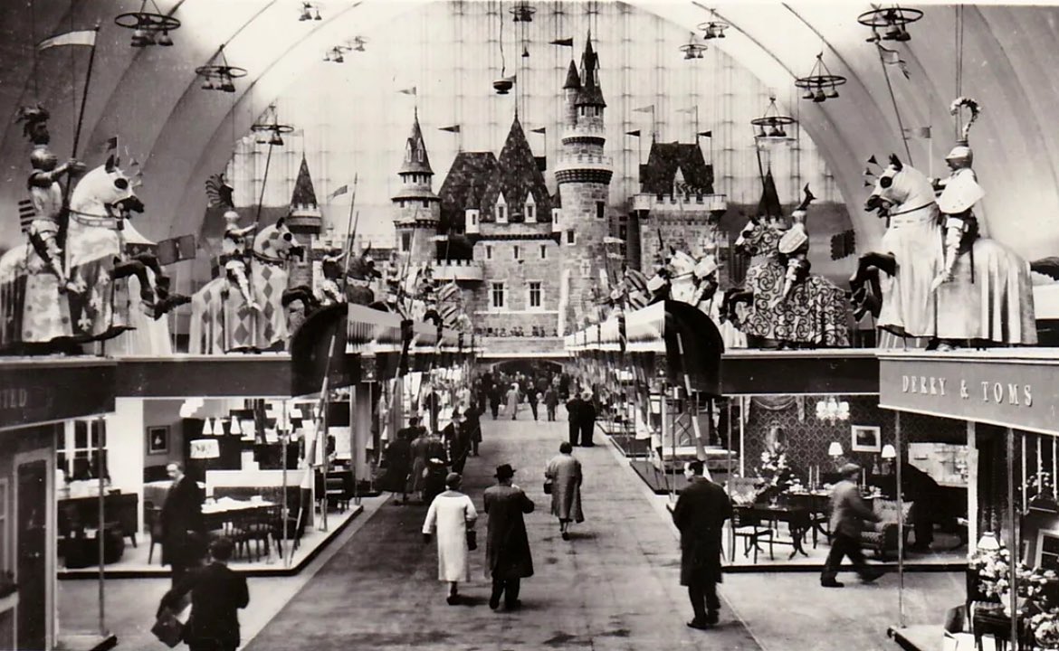 The magical interior of the Ideal Home Exhibition at Olympia grand Hall in 1956. See the Derry & Tom’s department store stand on the right.