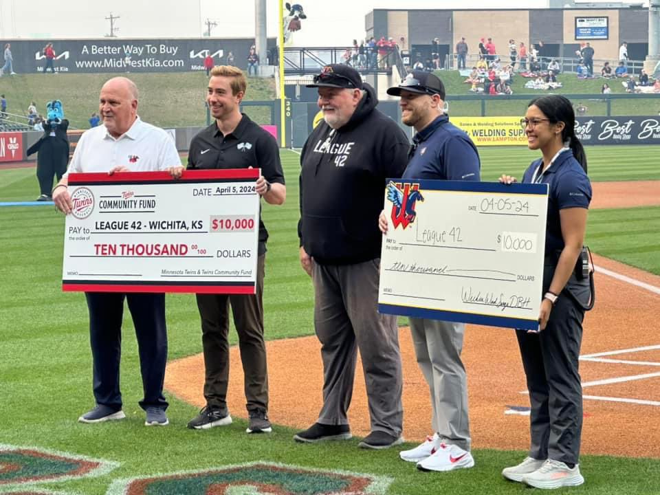 It was a big night for League 42 on Friday at the Wichita Wind Surge season opener at Riverfront Stadium. I was honored to accept two checks for $10,000 apiece from the Wind Surge and their parent organization, the Minnesota Twins. So appreciative of this support.