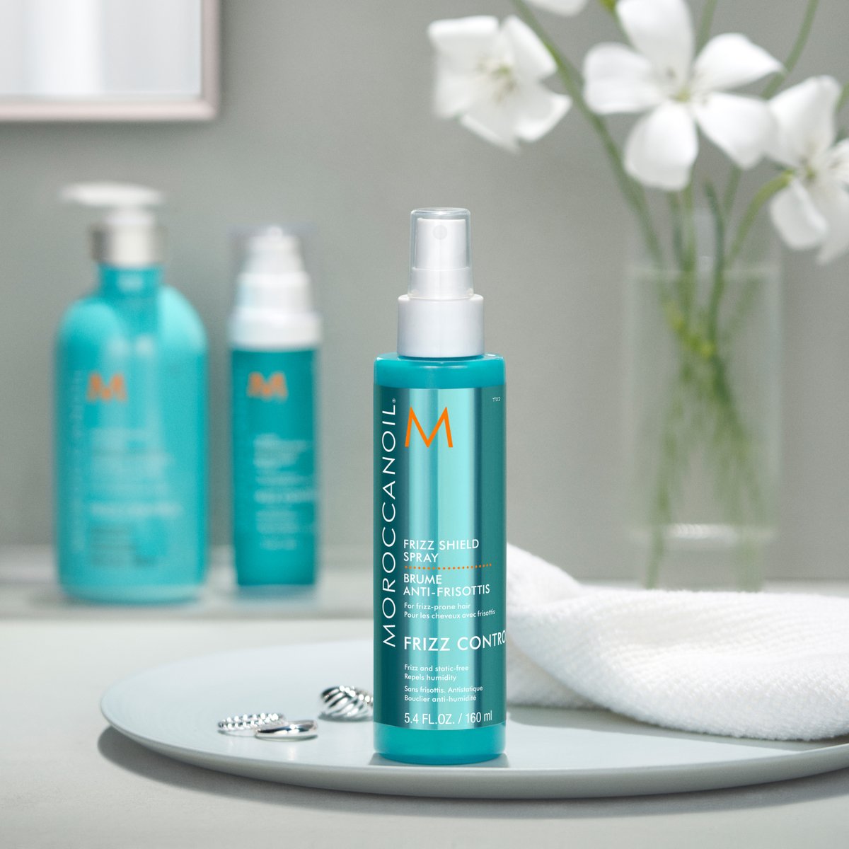 April showers have nothing on your hair.✨Frizz Shield Spray will keep you looking sleek and frizz free through even the most torrential of downpours. 🌧️