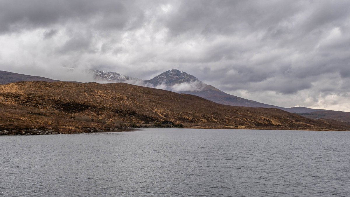 Looking across Loch a Chuillin towards Sgurr a Choire Rainich today. A very mild, but stormy day in the Highlands. The southerly wind has stripped a lot of snow off the hills.