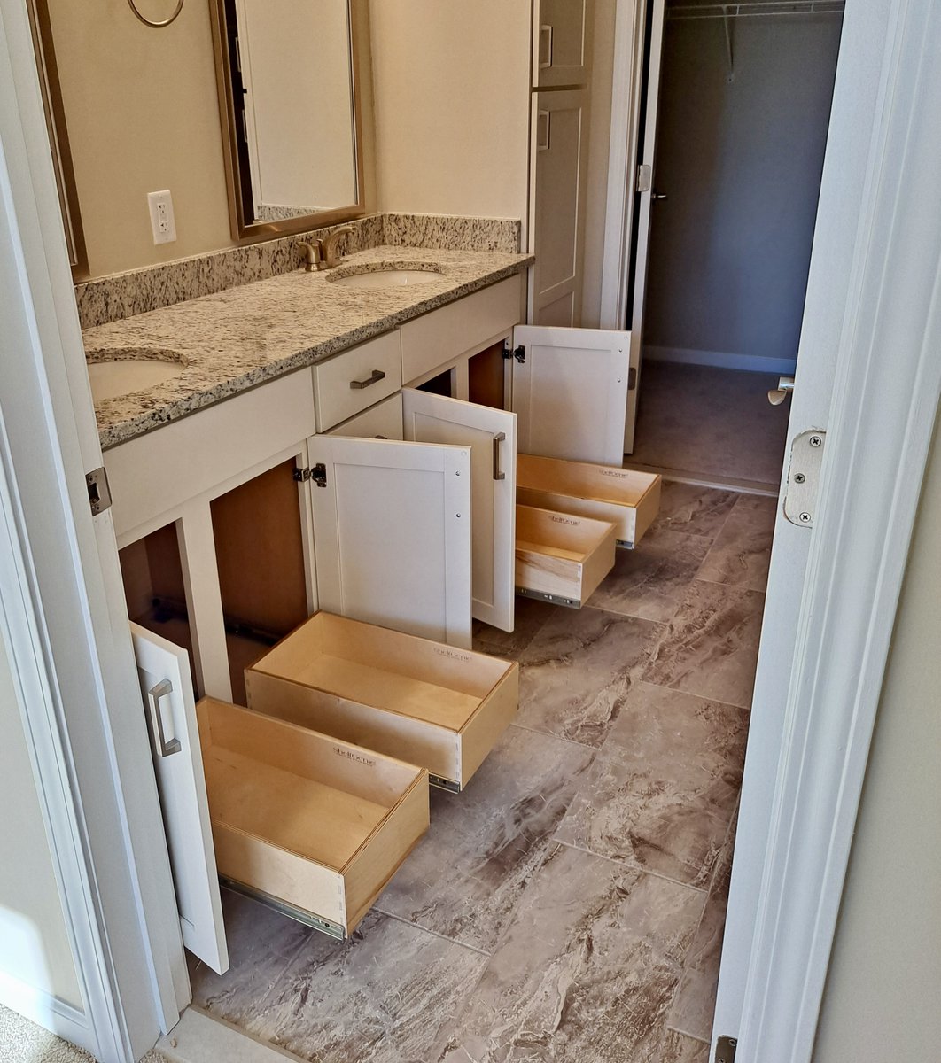 Adding pull-outs under your bathroom sinks makes access easier. Book your free design consultation at: shelfgenie.com #ShelfGenie #bathroom #bathroomorganization #organized #storagesolution #bathroomdesign #bathroomrenovation #sinks