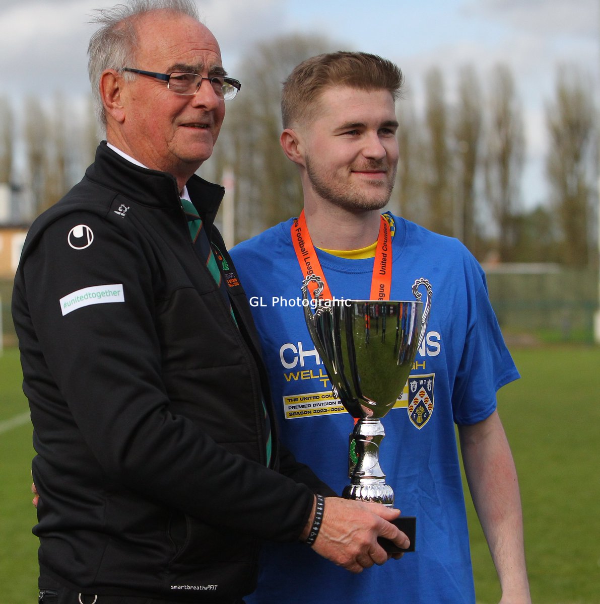 Jack O'Connor Club Captain of Wellingborough Town is presented with the UCL Premier South Trophy after this afternoons 2-1 Win over GNG Oadby Town