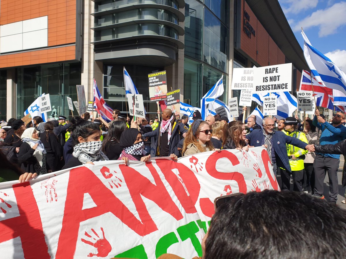 The red hands symbolise the murder of 2 Jews who were stabbed and disembowelled by terrorists who held up their bloody hands at a window #TheySupportTerror