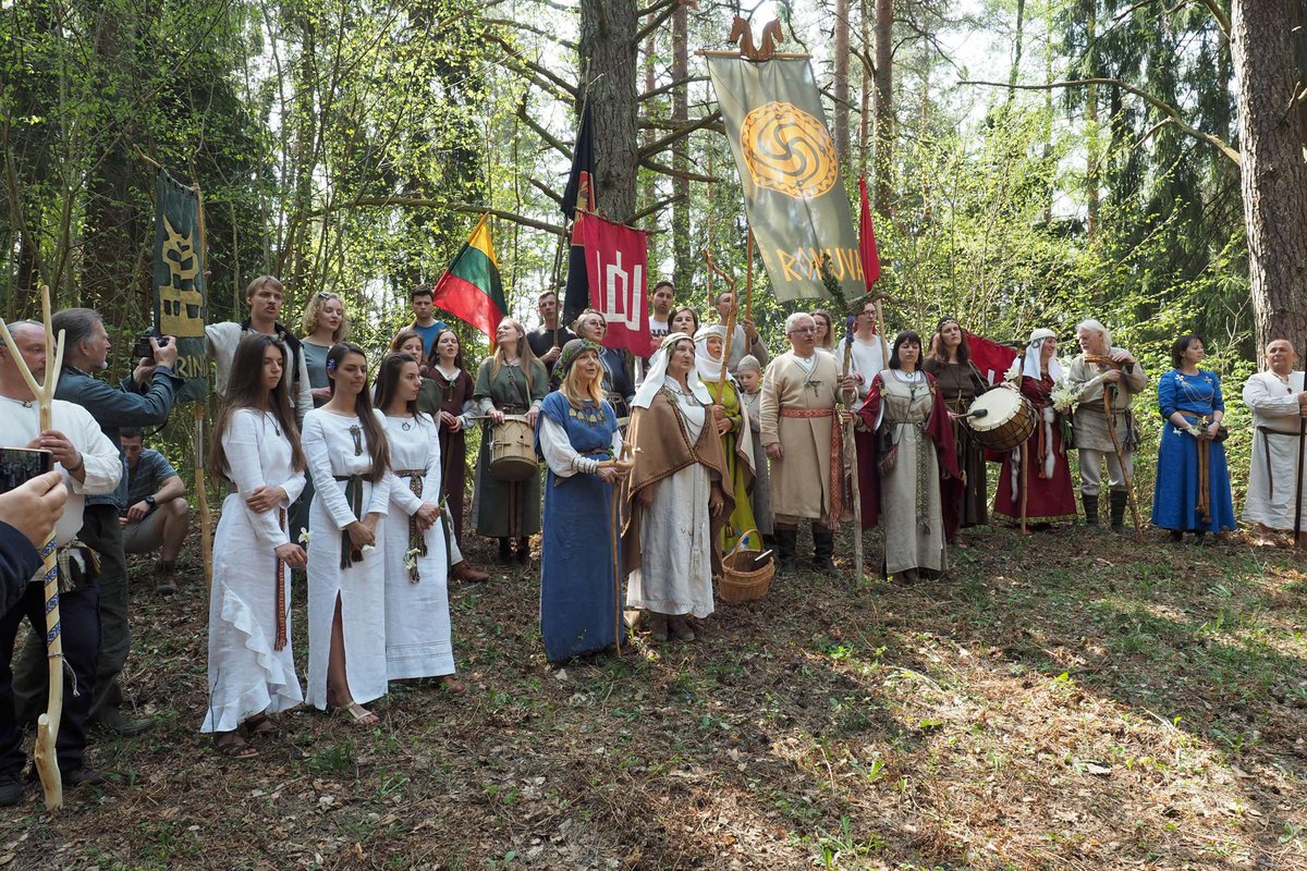 Image of a gathering of the Lithuanian pagans of #Romuva, probably last year's Jore celebration, a spring festival of greenery celebrated at the end of April. It is considered a symbolic day of the fertilisation of the Earth, as the first thunderstorm usually occurs around this…